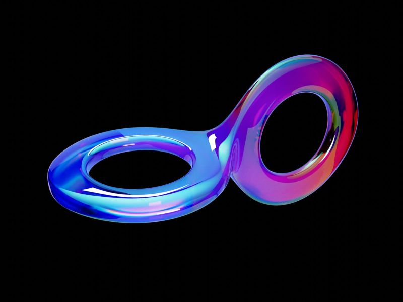 A glossy iridescent ribbon curving into a continuous double loop