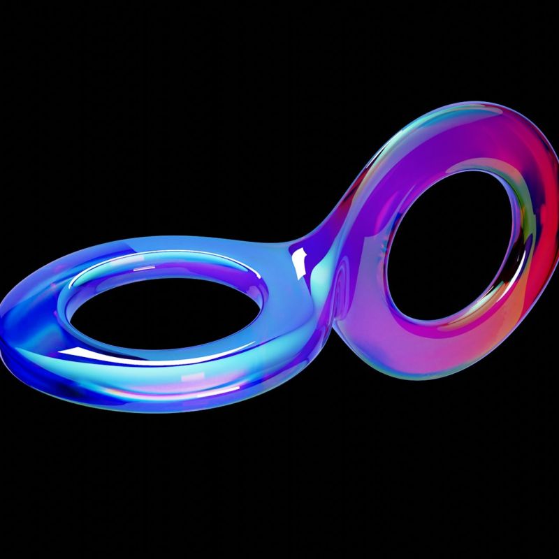 A glossy iridescent ribbon curving into a continuous double loop