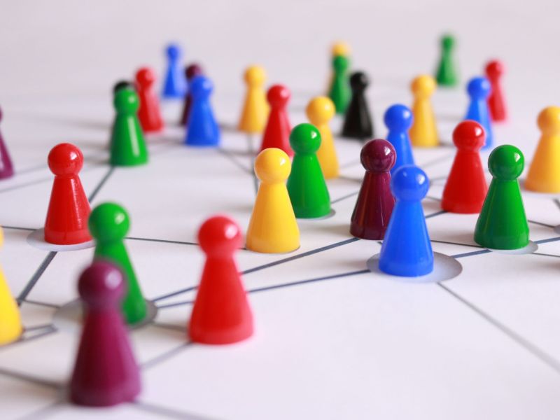 colored pegs on a white page with lines drawn connecting them